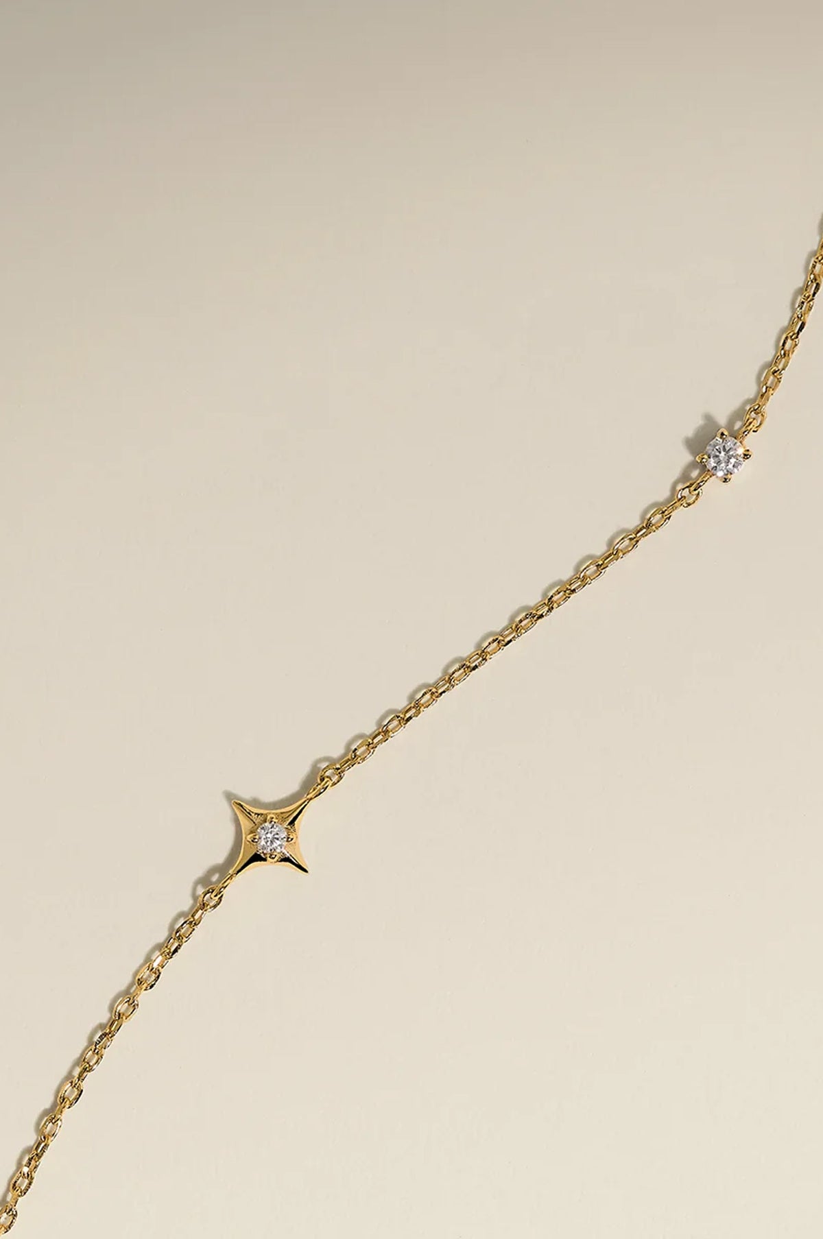 Cosmic Star Charm Bracelet in Gold